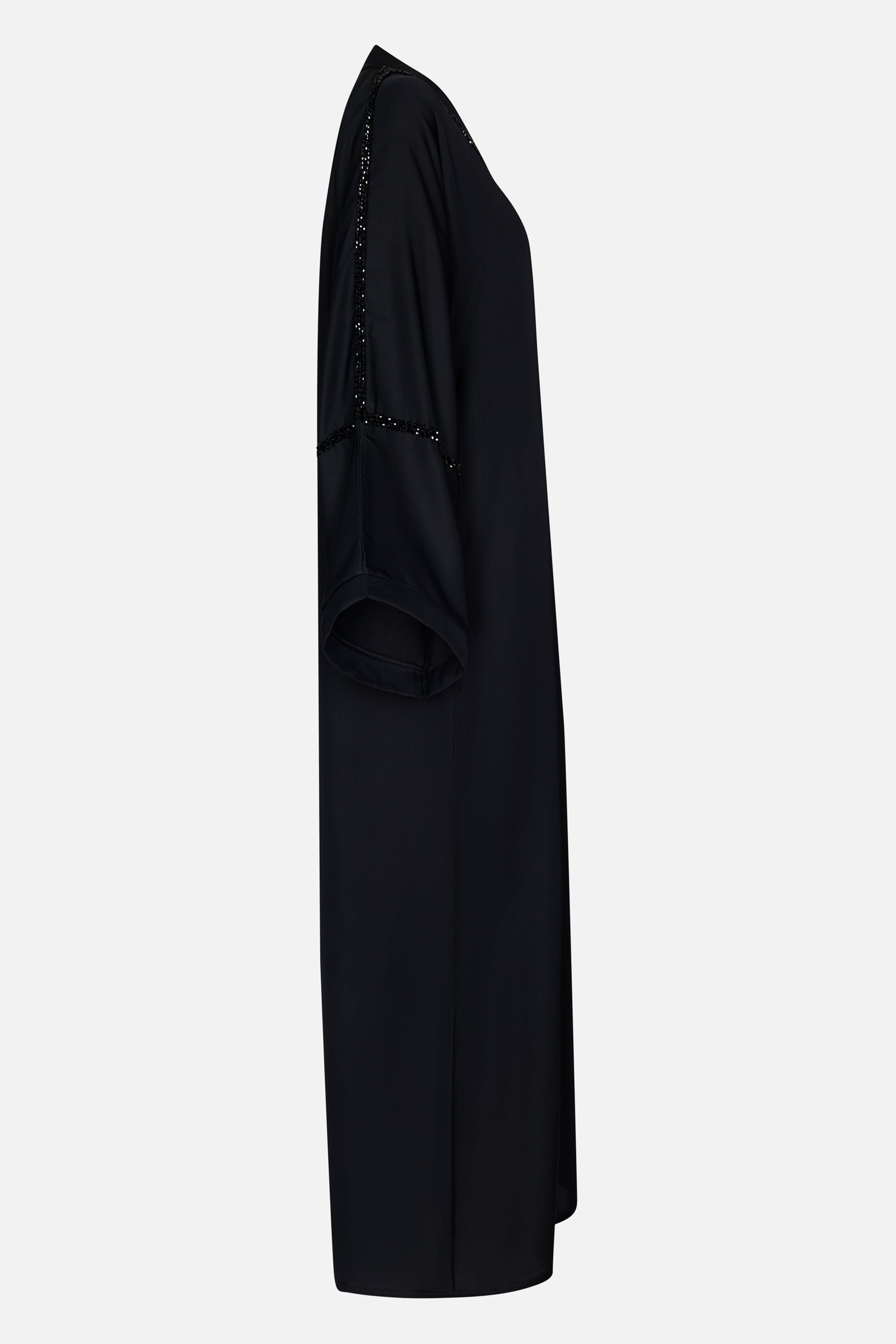 zijkant foto van de luminous noir abaya